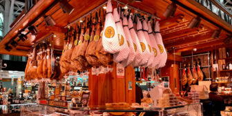 Hanging ham at a market stall in Valencia