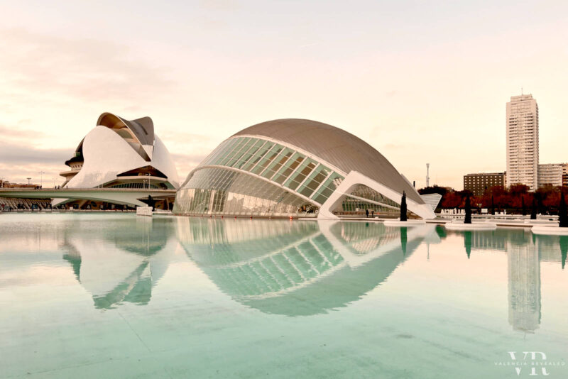 The Hemisfèric and Reina Sofía Opera House reflected in the surrounding pool of water