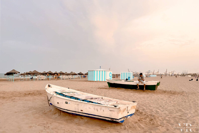 Old boats and umbrellas on Mavarrosa Beach