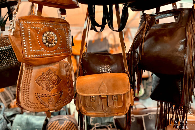 Hanging leather bags at a Christmas stall