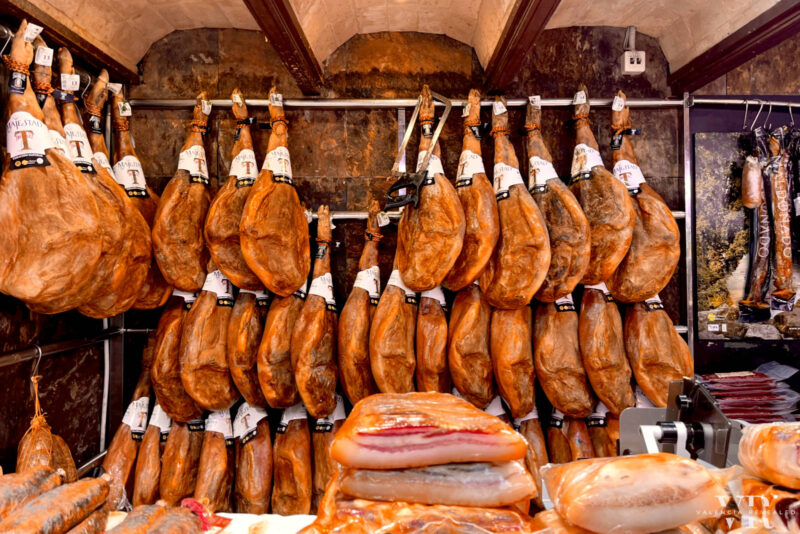 Hanging ham at a market in Valencia