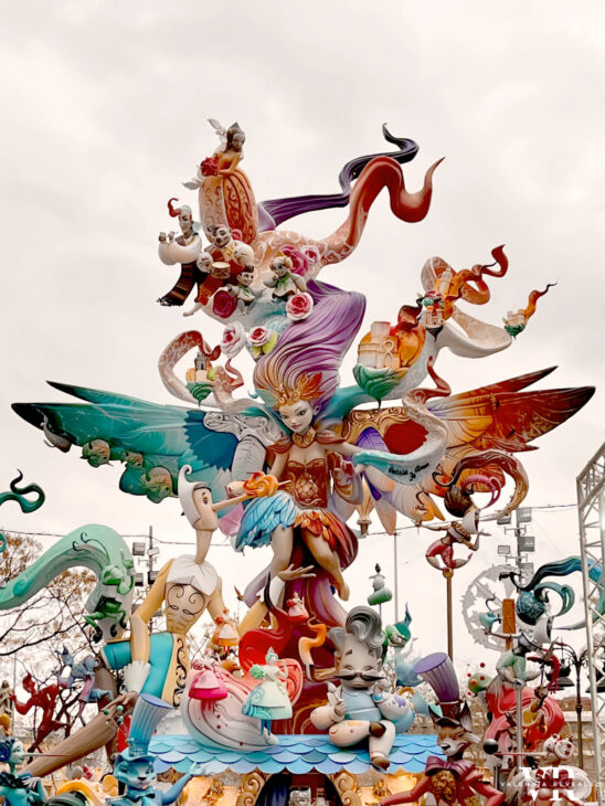 A colorful polystyrene sculpture depicting a fairy, Pinocchio, and other creatures. 