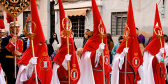 People wearing red pointed hoods during the Easter procession in Valencia