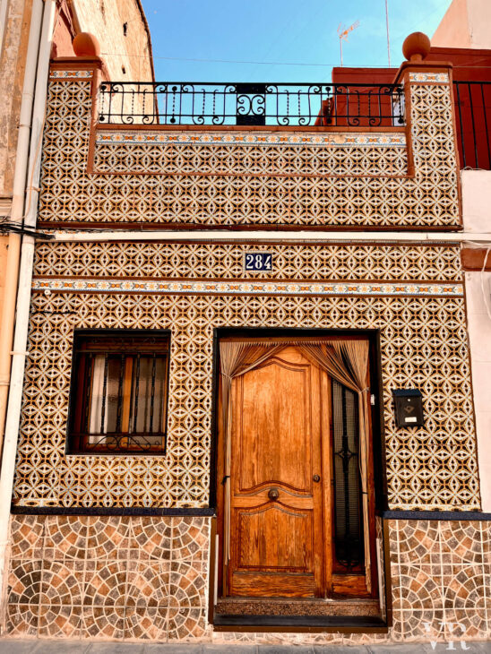 Tiled covered facade of a house in El Cabañal neighborhood