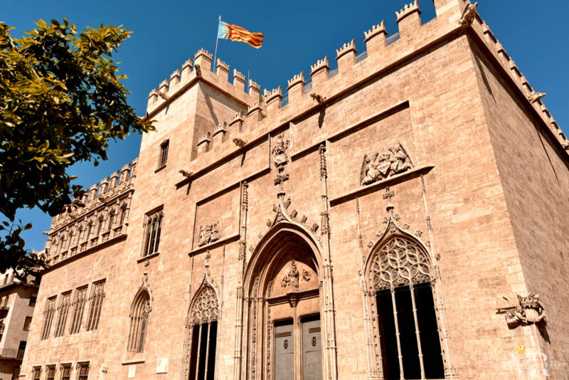 Gothic building of La Lonja with the Valencian flag at the top