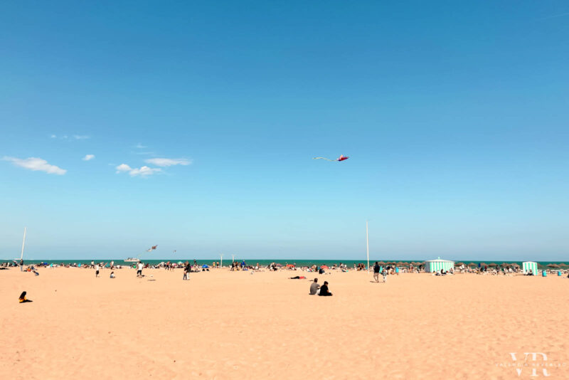 People flying kites on the Malvarrosa Beach in Valencia