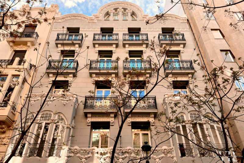 Modernista building in Valencia with leafless trees in front