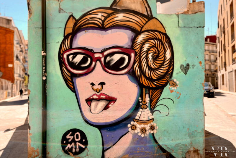 Street art of a fallera with sunglasses in Valencia