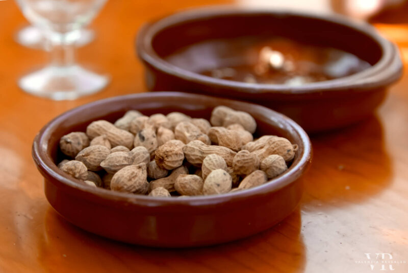 Peanuts in shells in an earthenware bowl