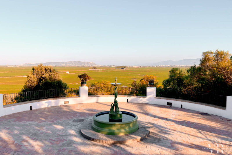 A water fountain on a terrace with panoramic views over the rice fields of Albufera